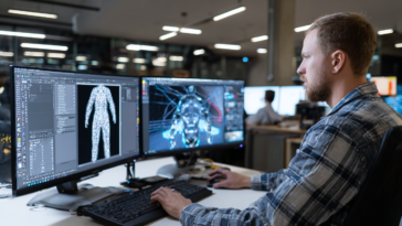 Artiste 3D travaillant sur une station graphique professionnelle avec écrans affichant un personnage animé en rigging et animation.